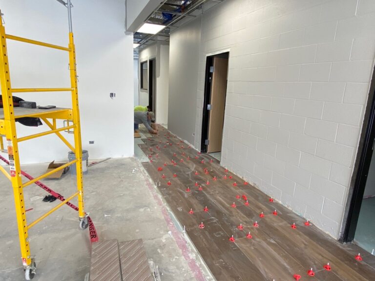 Industrial facility renovation and upgrades, installing flooring