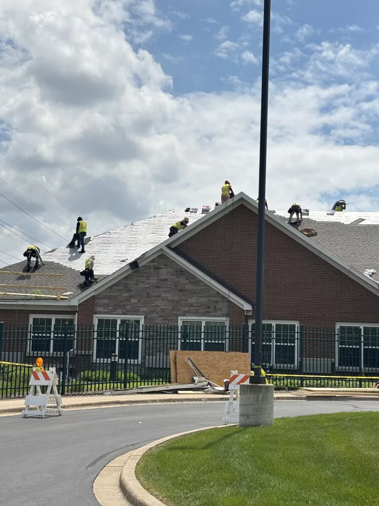 Roof replacement with crew working on a multifamily property in Naperville Illinois