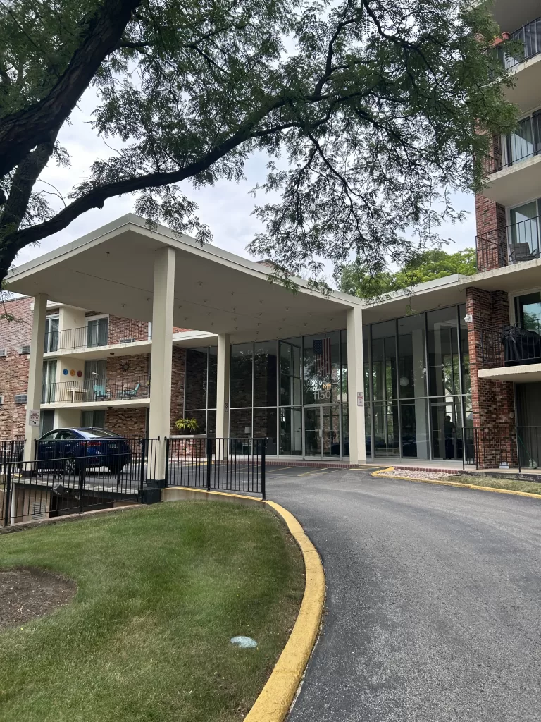 Exterior renovation project with updated entryway and expanded glass storefront design