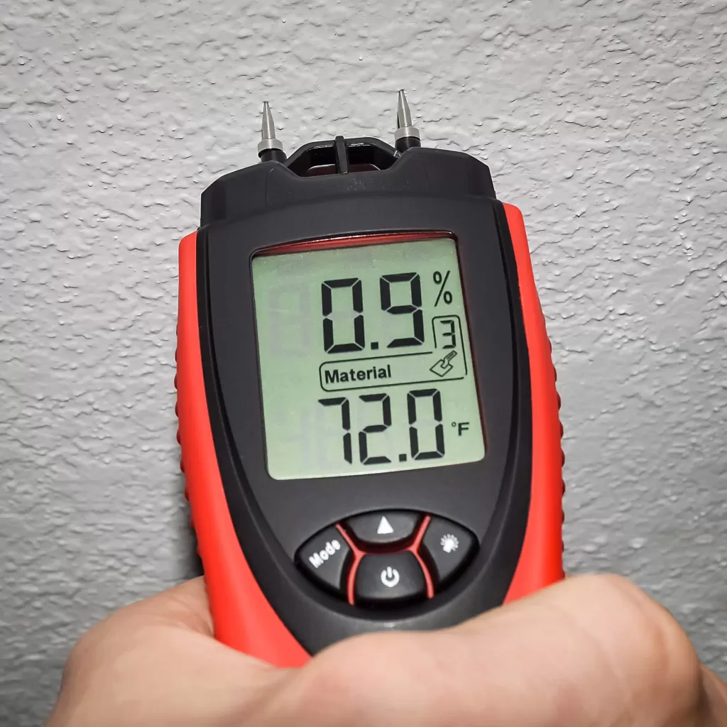 Moisture meter reading during water damage inspection in Naperville Illinois
