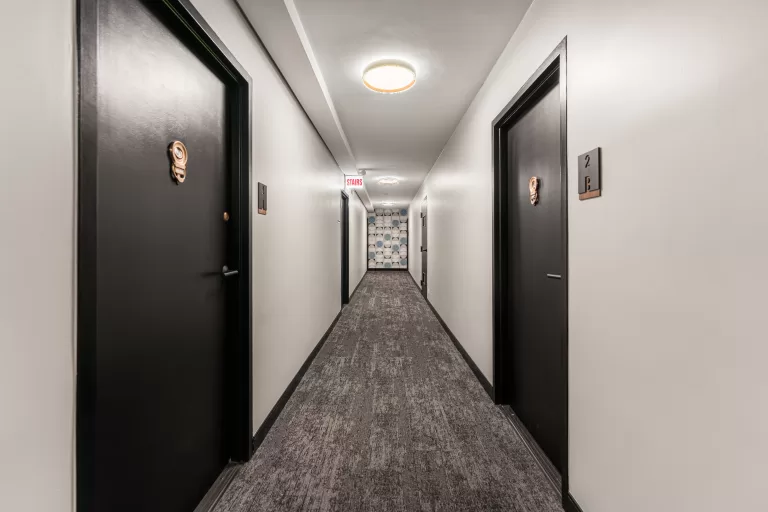 Bright hallway renovation with clean finishes and improved lighting