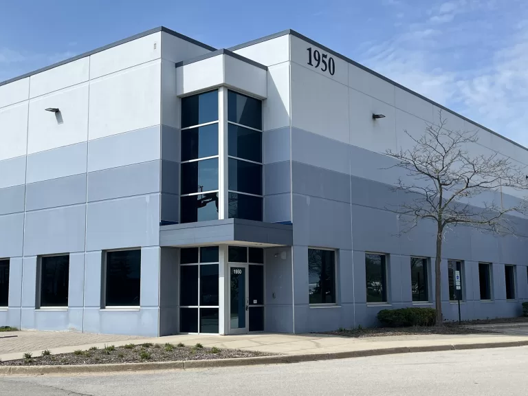 Completed industrial warehouse construction with sleek design and functional loading areas