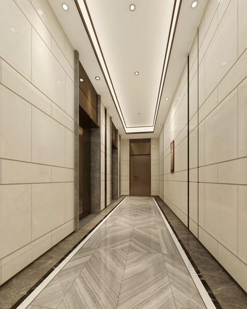 Elevator lobby with polished stone walls and modern lighting design